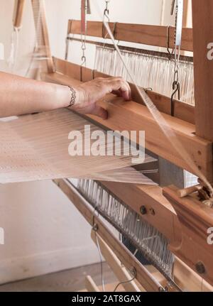 hand weaving textile with a handloom Stock Photo
