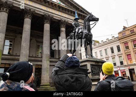 Glasgow, Scotland, UK. 31st Jan, 2020. The Duke of Wellington statue wearing an EU cone on Brexit day in Glasgow, Scotland drew lots of attention from passers by Credit: Kay Roxby/Alamy Live News Stock Photo