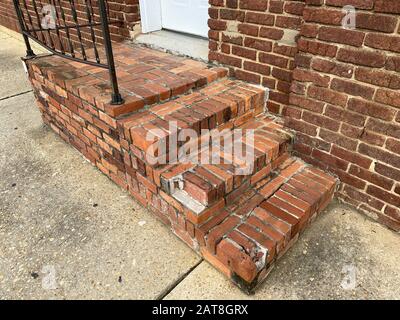 some old brick steps in an alley entrance Stock Photo