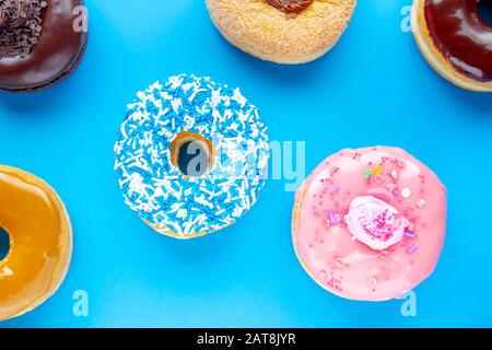 Colorful Donuts on a blue background Stock Photo
