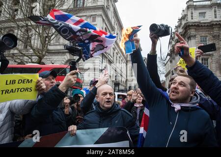 London, UK. 31 January, 2020. Brexit supporters burn an EU flag in Whitehall on Brexit Day. Credit: Mark Kerrison/Alamy Live News Stock Photo