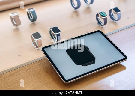 Turkey, Istanbul, December 20, 2019: Apple watch 5 series on a tablet is an advertisement or an offer, and in the background Apple watch in an official store Stock Photo