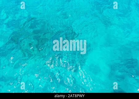Tropical sea, blue water in daylight. Abstract blue turquoise water for background, nature concept. Greece holiday. Stock Photo