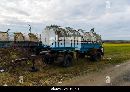 rusty and decaying milk tank trailers as they were used in the German Democratic Republic GDR Stock Photo