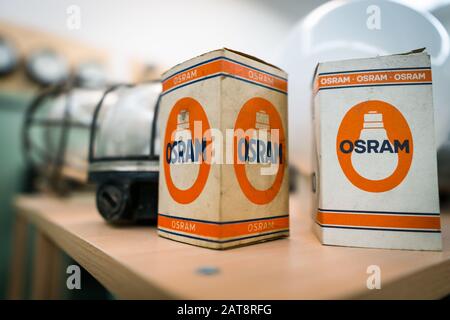 Augsburg, Germany - January 25, 2020: two old Osram boxes on a wooden shelf Stock Photo