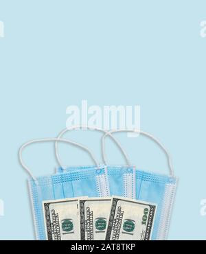 Money on surgical protective mask high price or sold out conceptual image. Coronavirus 2019 nCov China epidemic. Stock Photo