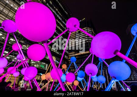 'Affinity' light sculpture by Amigo & Amigo and S1T2, at Montgomery Square. 2020 Winter lights festival in Canary Wharf, London, England. Stock Photo