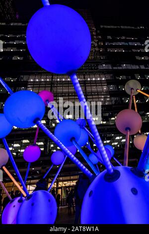 'Affinity' light sculpture by Amigo & Amigo and S1T2, at Montgomery Square. 2020 Winter lights festival in Canary Wharf, London, England. Stock Photo