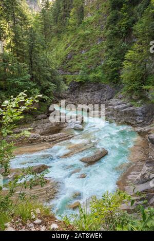 Blue colored mountain river in a canyon in the Alps Stock Photo