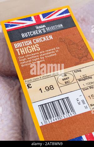 Plastic film wrapped ASDA chicken thighs with Union Jack graphic - British farm produce concept, food label close up, food packaging materials. Stock Photo