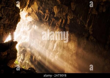 Light shinning through cave opening at Tham Phu Kham Cave in Vang Vieng, Vientiane Province, Laos.