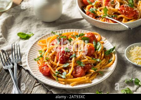 Homemade Bucatini all Amatriciana Pasta with Tomato and Basil Stock Photo