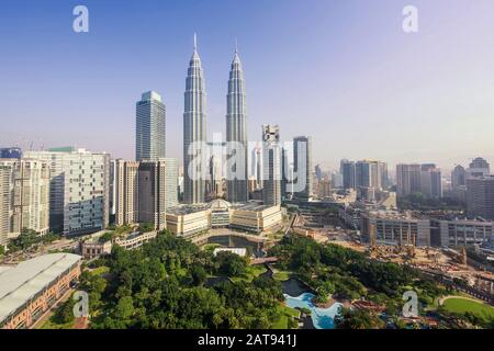 View of Petronas Towers and Kuala Lumpur skyline during daytime in Kuala Lumpur, Malaysia. Stock Photo