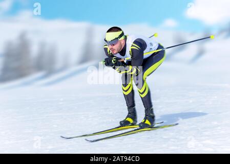 Cross-country skiier in downhill position Stock Photo