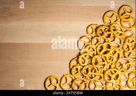 pretzels with coarse salt on a wooden board Stock Photo