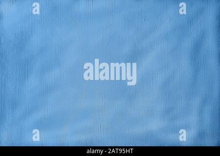 Flat lay Minimal creative cloth background toned in monochrome classic blue color. Stock Photo