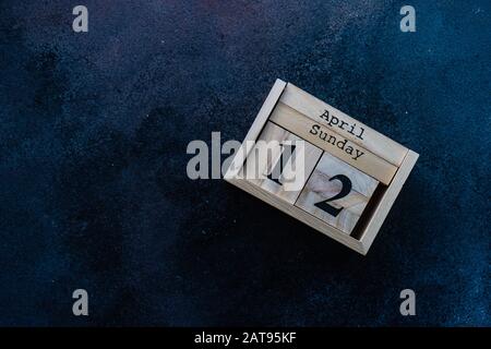 Easter card concept with colored eggs on stone background with copy space Stock Photo