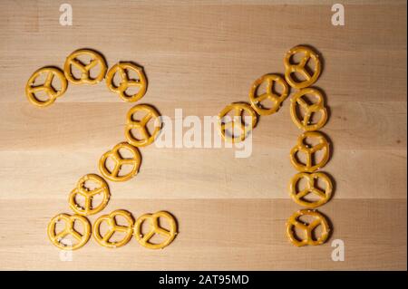 pretzels on a wooden board number 21 Stock Photo