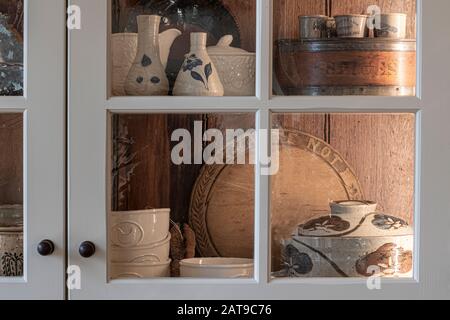 Dishes in Country Rural Cupboard Stock Photo