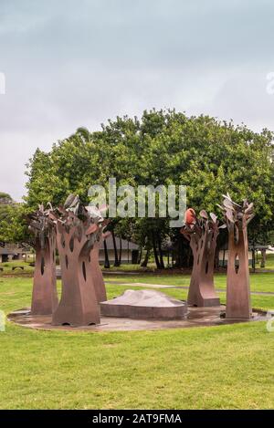 Kahului, Maui,, Hawaii, USA. - January 12, 2020: Portrait of Brown rusty metal group of trees statue on green lawn at University of Hawaii, Maui colle Stock Photo