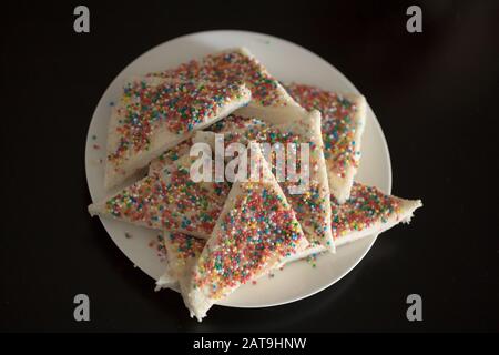 a plate of fairy bread, bread buttered and then sprinkled with sprinkles Stock Photo