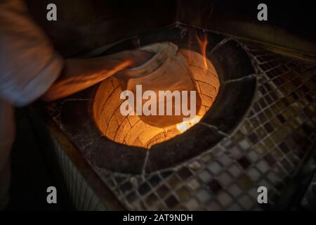 Traditional turkish wood fired stone brick oven and pita or pide bread  dough. This stone oven for Turkish pide or pita bread. Also known as Tandir  Stock Photo - Alamy