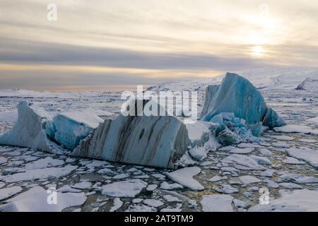 Aerial view of the J kuls rl n glacial lagoon and floating icebergs. The beginning of spring in Iceland Stock Photo