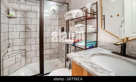 Panorama frame Bathroom interior with black and white tile wall and marble countertop Stock Photo