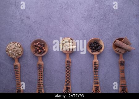 various herbs and spices on spoon on table  Stock Photo