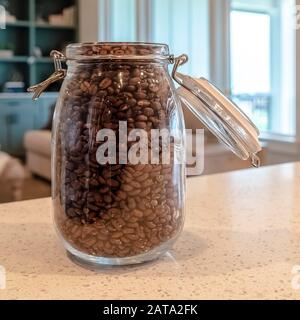 Download Photo Square Open Glass Jar Filled With Black Coffee Beans On Kitchen Counter Top Of Home Stock Photo Alamy PSD Mockup Templates