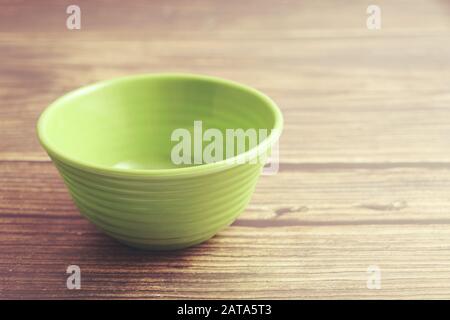 Indian made plastic bowl isolated on wooden table Stock Photo