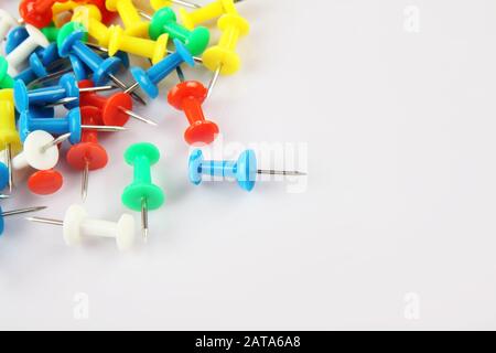 Metal push pins on white background Stock Photo