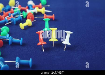 Metal push pins on Blue background Stock Photo