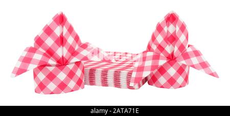 Red gingham pattern paper napkins folded into bishops mitre isolated on a white background Stock Photo