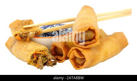 Chinese crispy duck filled spring rolls with soy sauce dip isolated on a white background Stock Photo