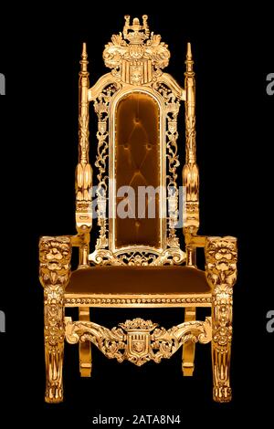 Golden royal chair isolated on black background. A place for the king. Throne. Royal chair. Stock Photo