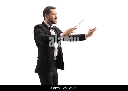 Male conductor in a suit conducting with a baton and gesturing with hand isolated on white background Stock Photo