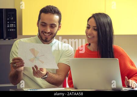 Business team at work. Group of young confident business people discussing project while spending time in the office Stock Photo