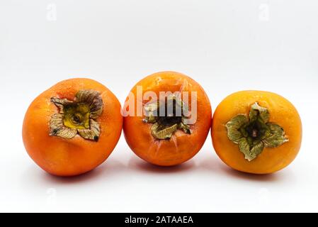 Ripe orange persimmon fruit. Kaki isolated on white background Stock Photo