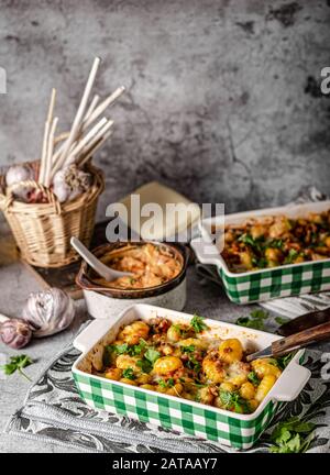 Super fast and delicious food, gratinated gnocchi with minced meat, tomatoes and cheese Stock Photo