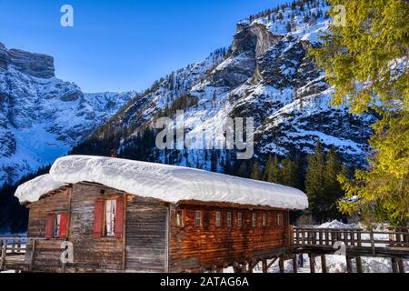 Wooden construction on Lake Braies for the shelter of rental boats. HDR image Stock Photo