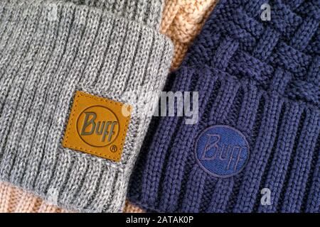 Tambov, Russian Federation - November 16, 2019 Two knitted hats with clothes labels Buff. Close-up. Stock Photo