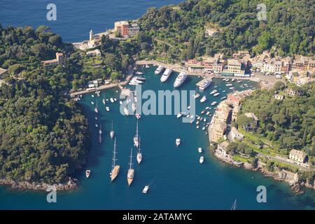 AERIAL VIEW. Portofino's natural harbor. Metropolitan city of Genoa, Liguria, Italy.