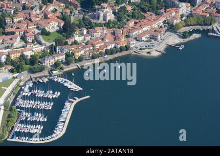 AERIAL VIEW. Picturesque lakeside town of Laveno. Laveno-Mombello, Lake Maggiore, Province of Varese, Lombardy, Italy. Stock Photo