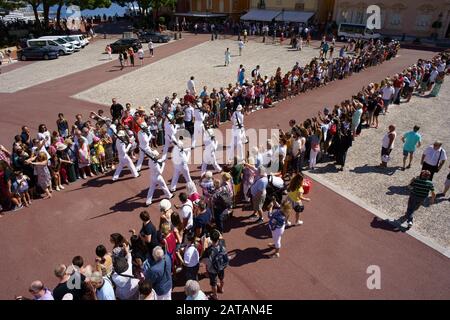 AERIAL VIEW from a 6m mast. Changing of the guard in front of the Prince's Palace. Monaco-Ville, Principality of Monaco. Stock Photo