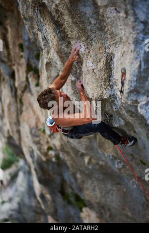Climber climbing a clif in National park Paklenica in Croatia Stock Photo