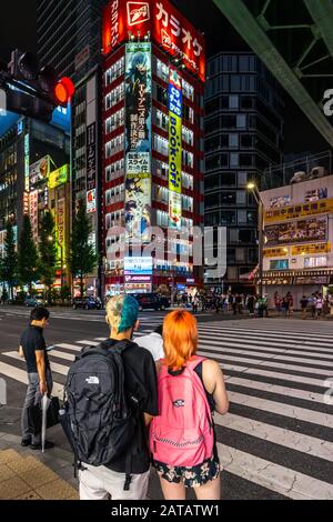 Tokyo, Japan, August 13, 2019 – Two youngsters at Akihabara, a Tokyo's district full of electronics and manga shops Stock Photo