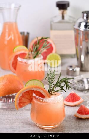 Cocktail fresh lime and rosemary combined with fresh grapefruit juice and tequila. A festive drink is ideal for brunch, parties and holidays. Stock Photo