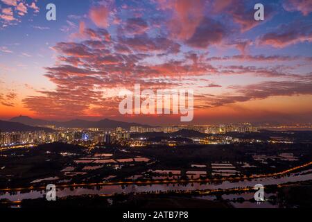 Aerial View of rural green fields in Hong Kong border at sunset Stock Photo