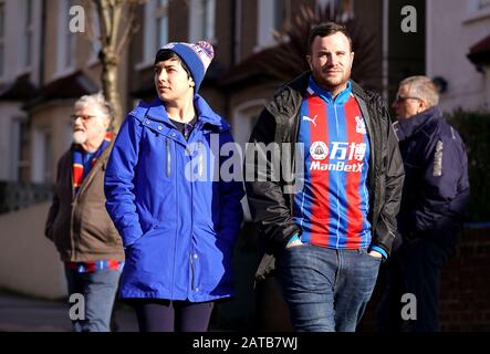 Crystal Palace fans arrive to the ground ahead of the Premier League match at Selhurst Park, London. Stock Photo